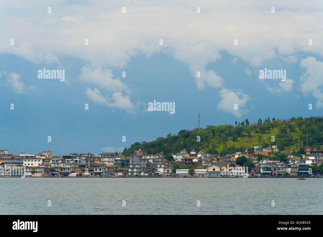 Jinsuo Island, located in the center of Erhai Lake, is famous for its picturesque location surrounded by clear, mirror-like waters. Stock Photo