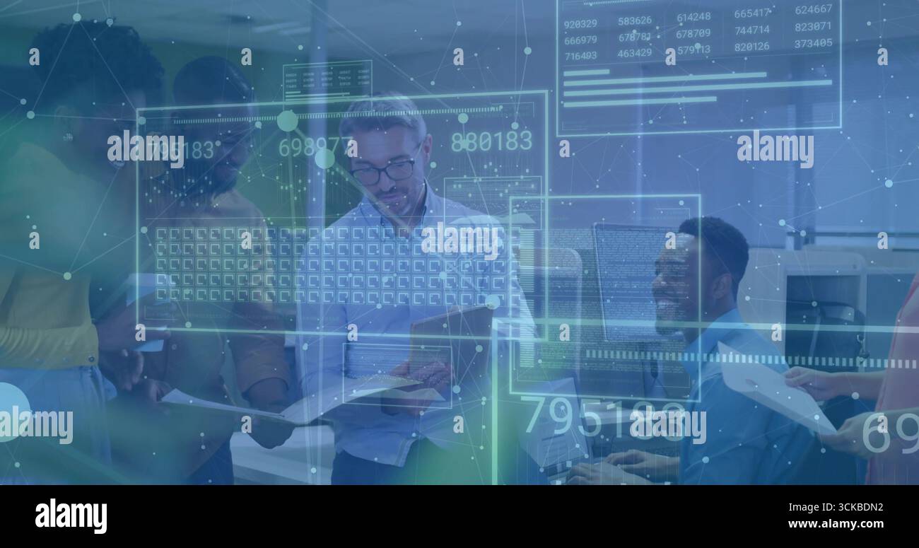 Five office workers analyzing reports at workstations in modern office ...