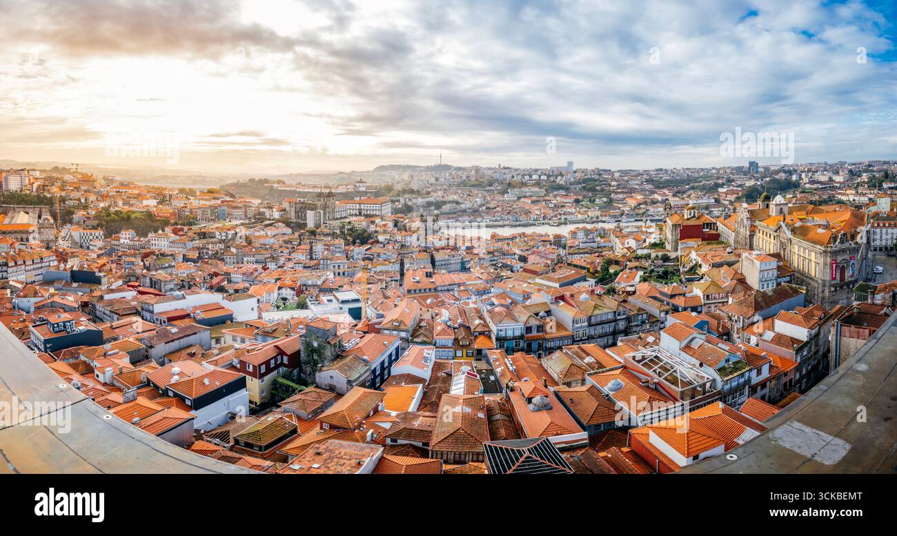 Porto Cityscape With Terracotta Roofs and Historic Buildings Under a Blue Sky. Portugal travel, urban landscape, city view, aerial perspective Stock Photo