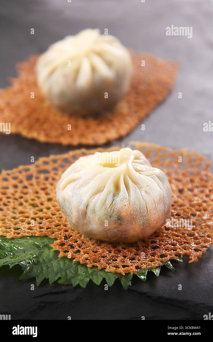 Pan-Fried Bao with Crispy Skirt, Chinese Dim Sum Duo Stock Photo - Alamy