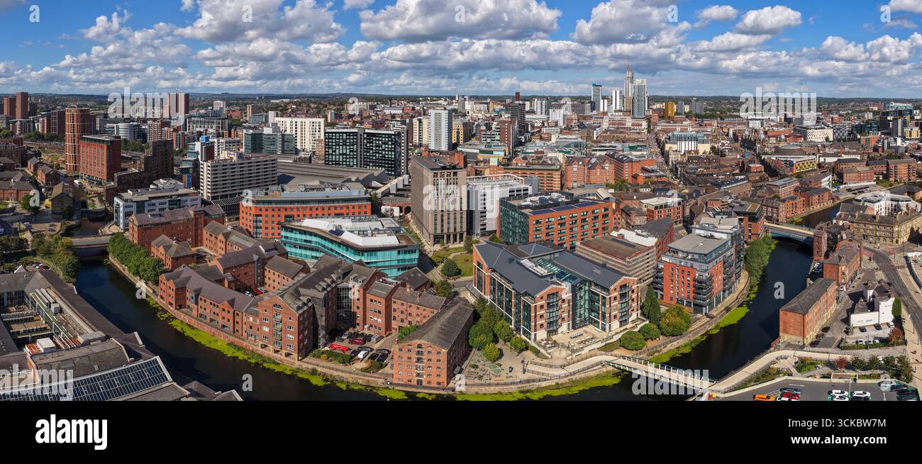 Panoramic aerial image of Leeds city centre, featuring River Aire, modern offices, and urban architecture in Yorkshire, England. Stock Photo