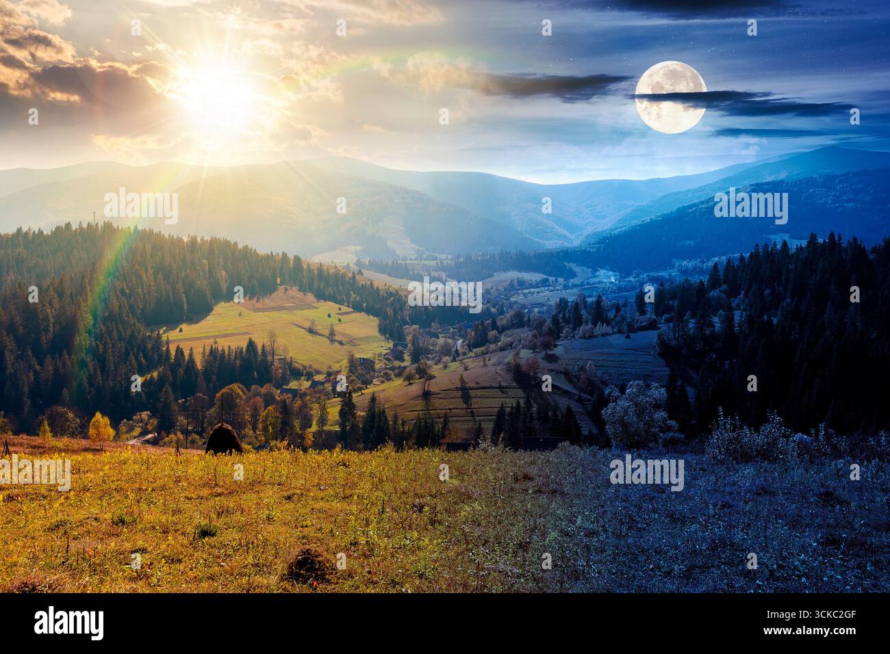 landscape with coniferous forest behind the meadow on autumn equinox. day and night time change concept. nature background with blue sky and mountain Stock Photo