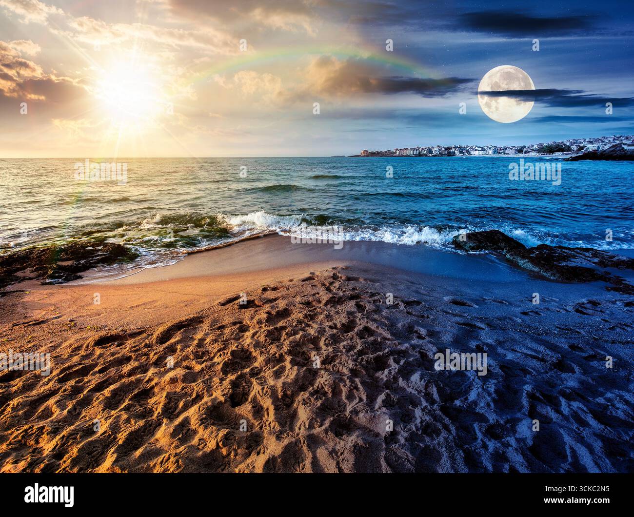sunrise on a sandy town beach on equinox season. day and night time change concept. beautiful and warm weather on the shores of black sea. coast with Stock Photo