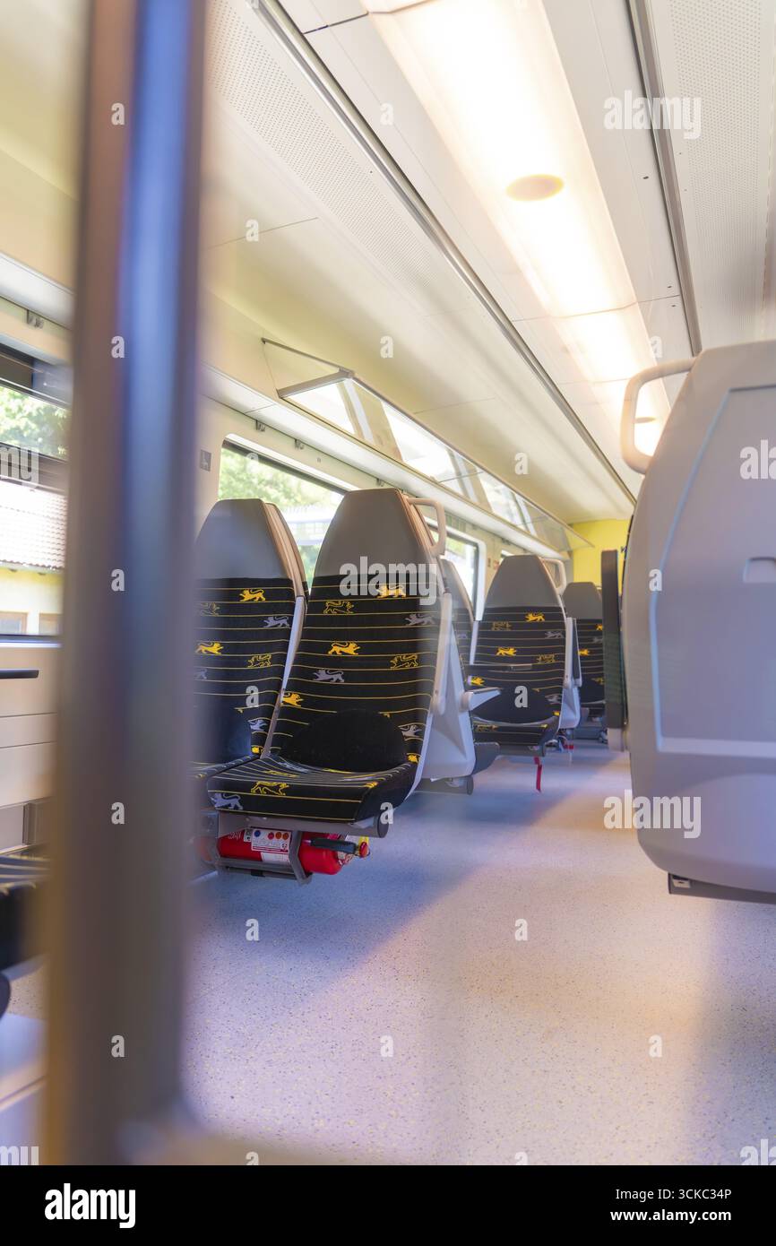 Bright Train Inside Bright train interior with several rows of seats, battery Electric ...