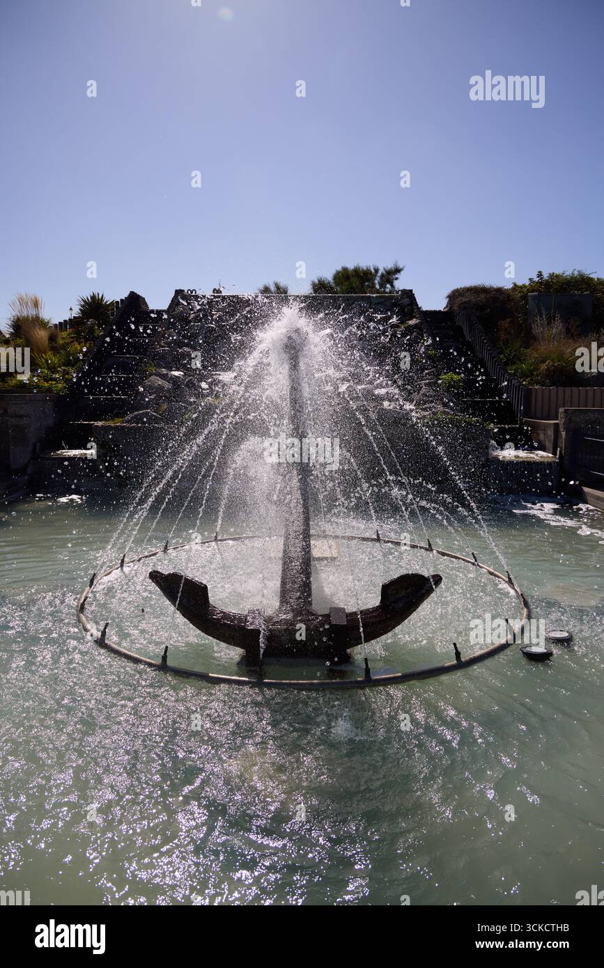 Anchor sculpture and water feature at Sutton-on-Sea, Lincolnshire, England. Decorative seaside landmark combining maritime heritage with public art in Stock Photo