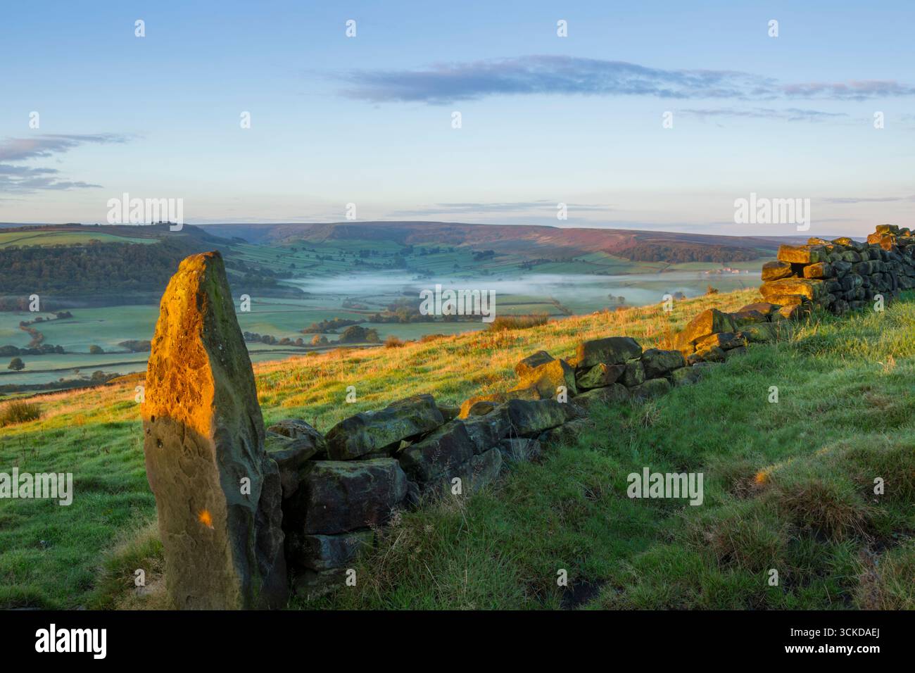 Early autumn morning view just after sunrise  looking into a misty Danby Dale in the Esk valley within the North York Moors national park - Stock Image