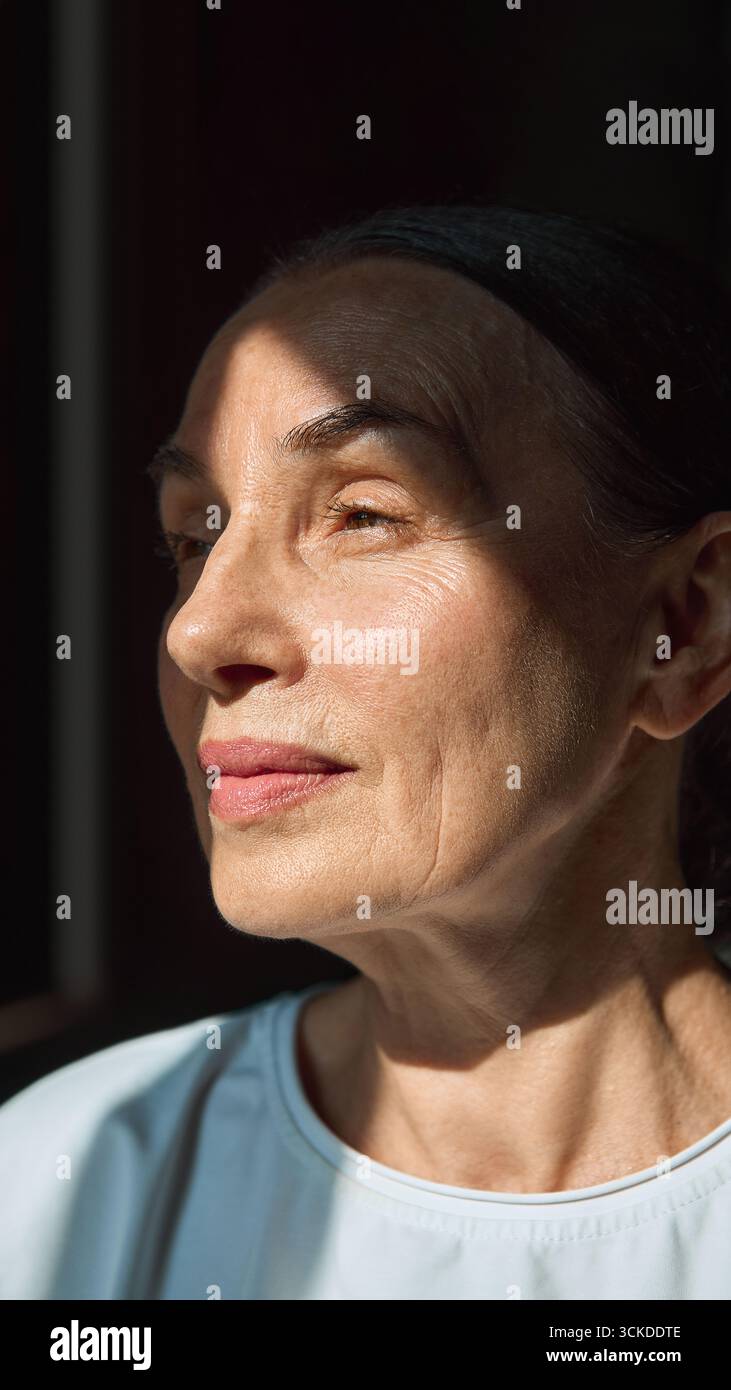 Elderly woman portrait with natural sunlight on face Stock Photo - Alamy