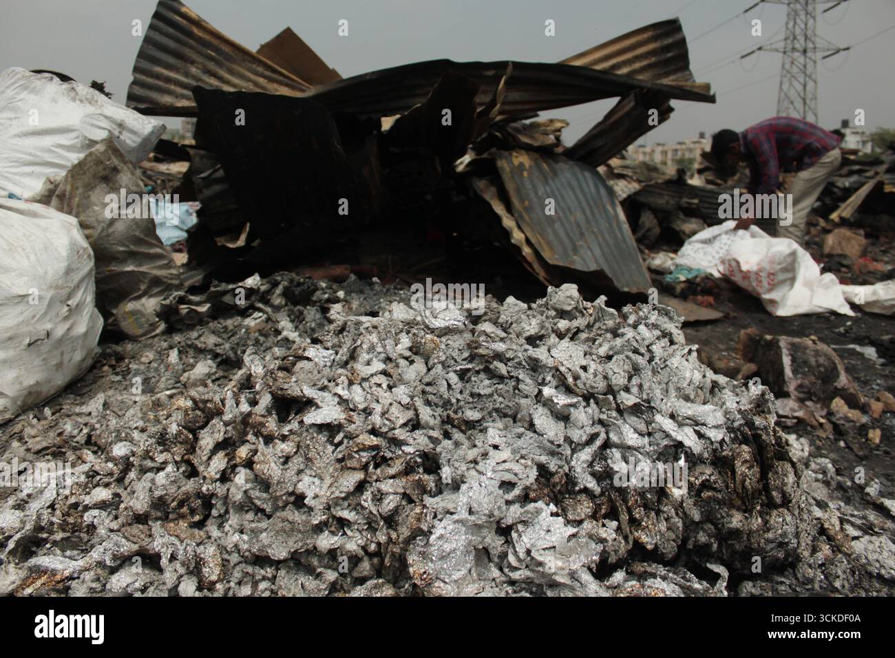 Horrific scenes of fire devastation in a slum in Delhi, India. Stock Photo