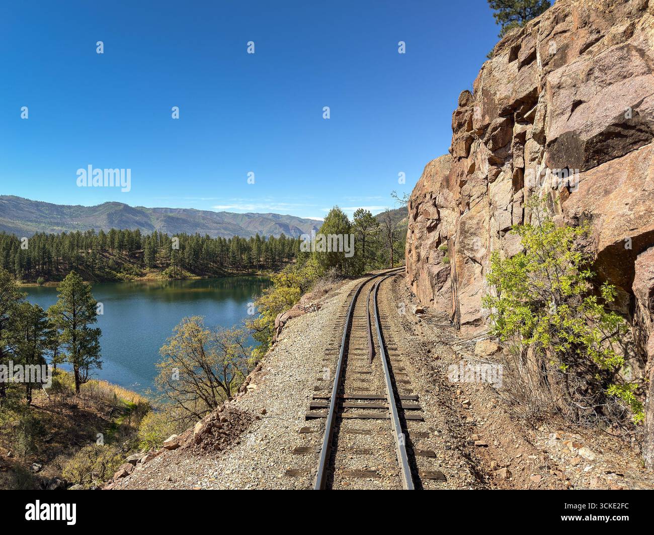 Curve in the track on the Durango and Silverton narrow gauge railway on the ledge of a mountain. No people. - Smartphone Captured Stock Image