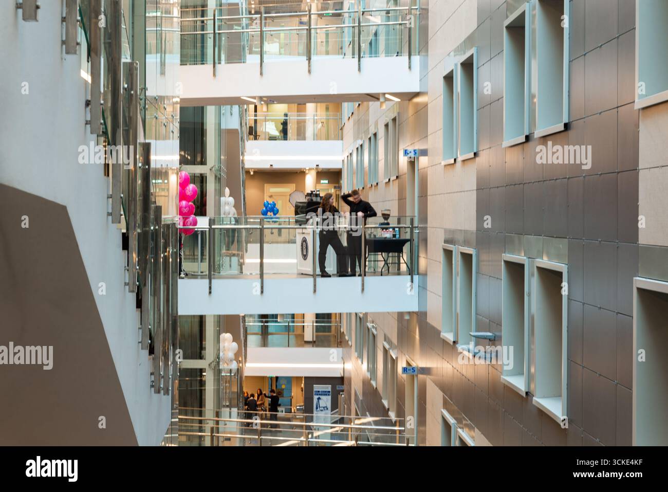 Multi Level Office Modern multi-level office interior with glass railings and decor Stock ...