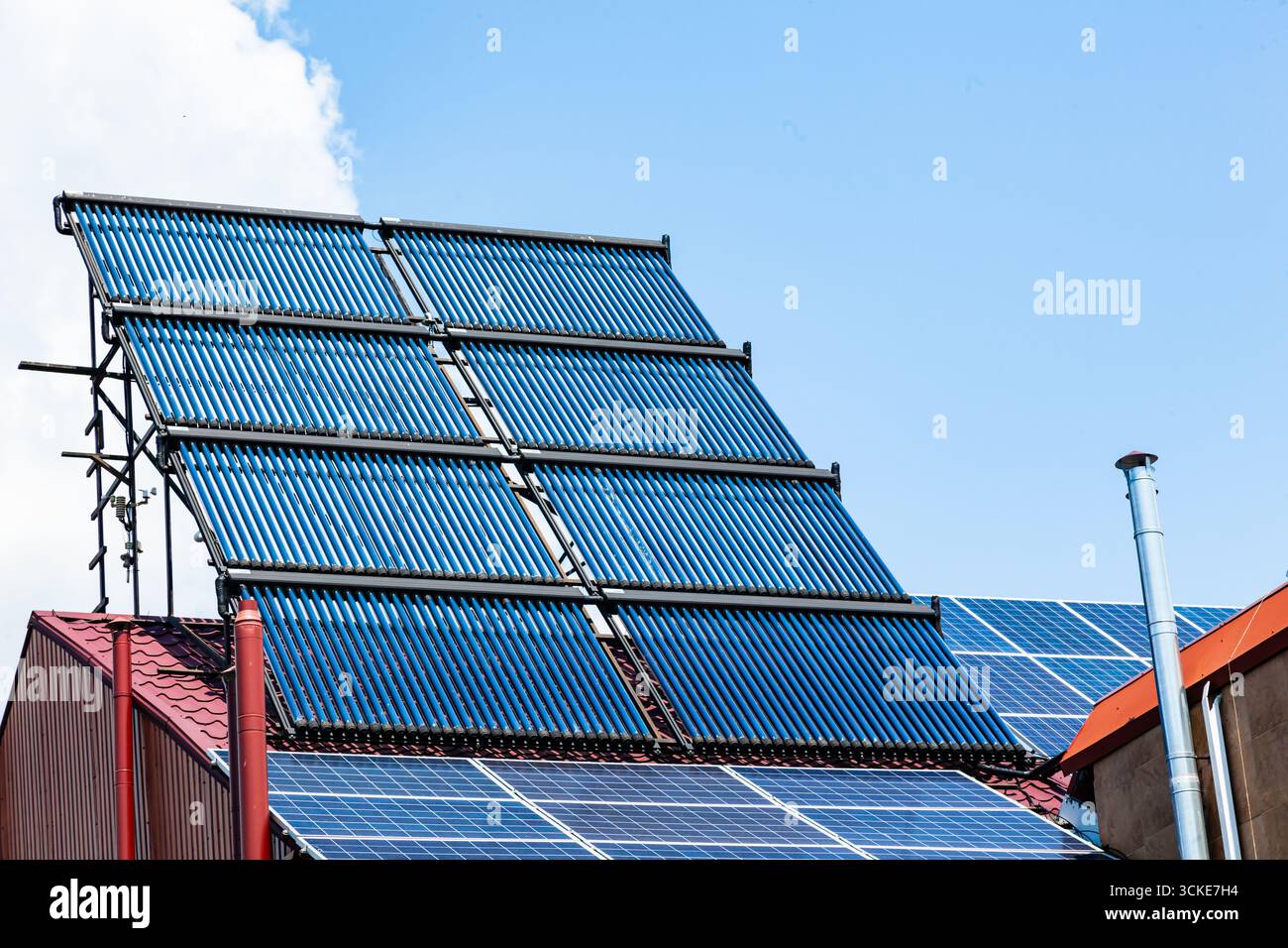 The roof of an energy efficient home with solar panels and solar water ...