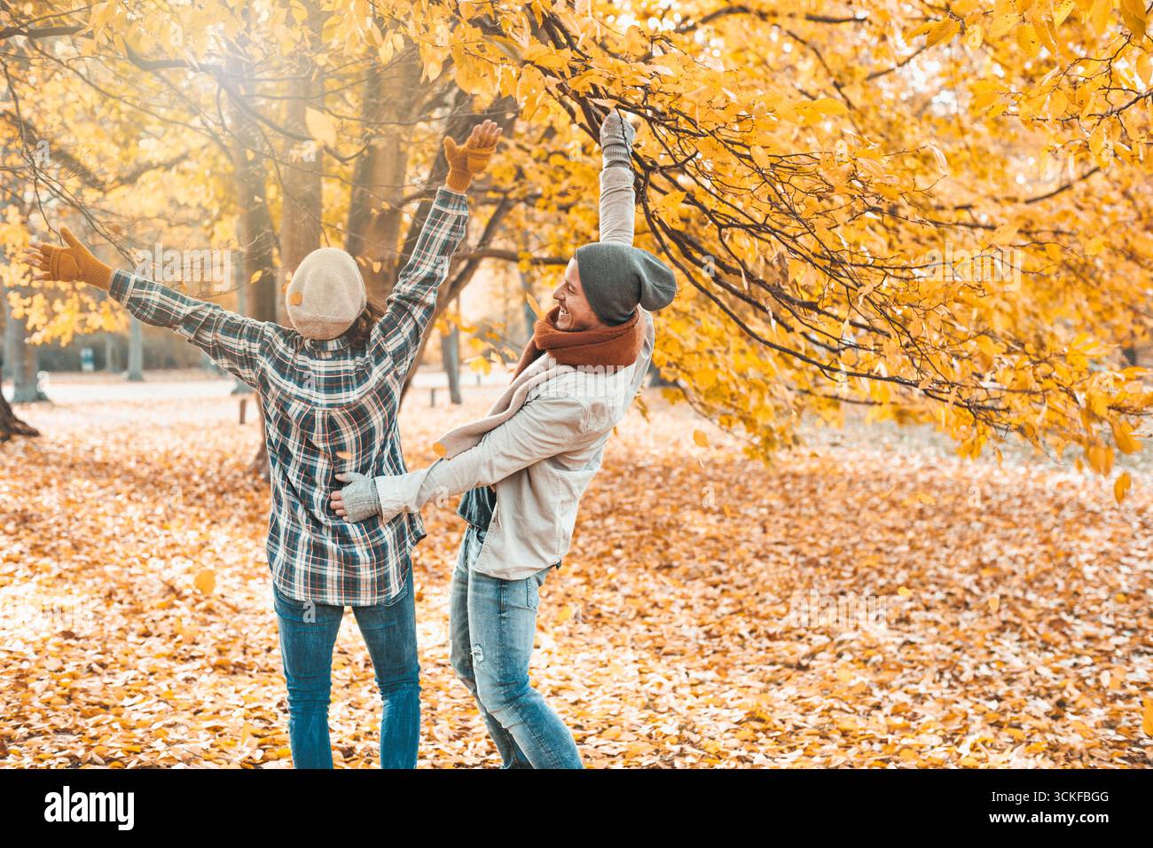 cheerful couple taking an autumn walk Stock Photo