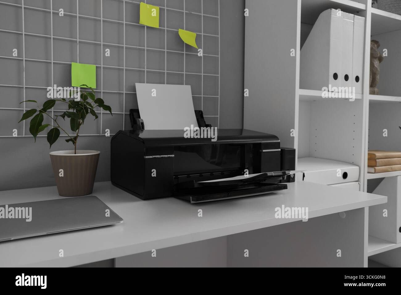 Modern printer on desk in office, closeup Stock Photo
