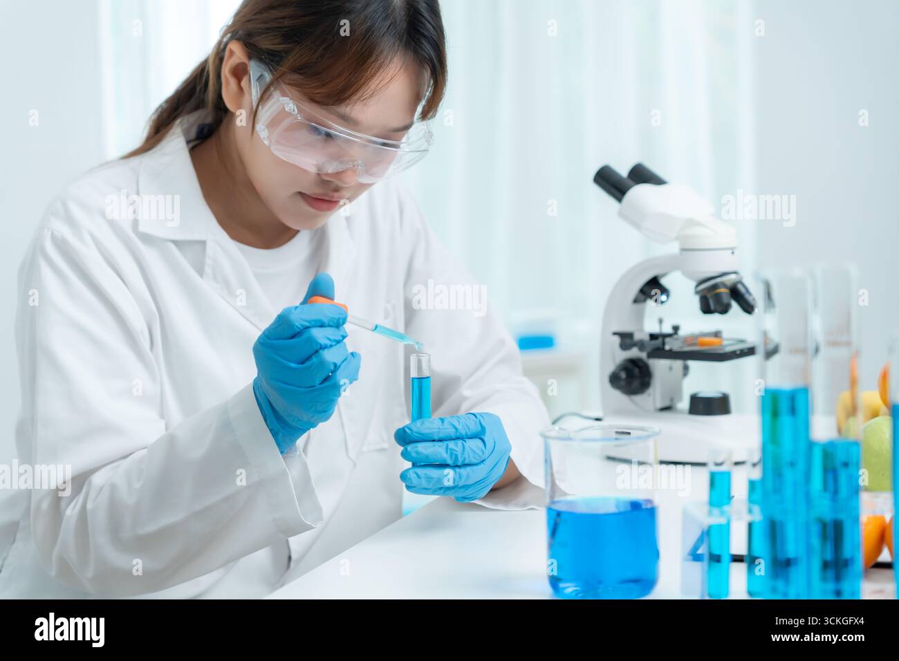 Scientist check chemical food residues in laboratory. Control experts ...