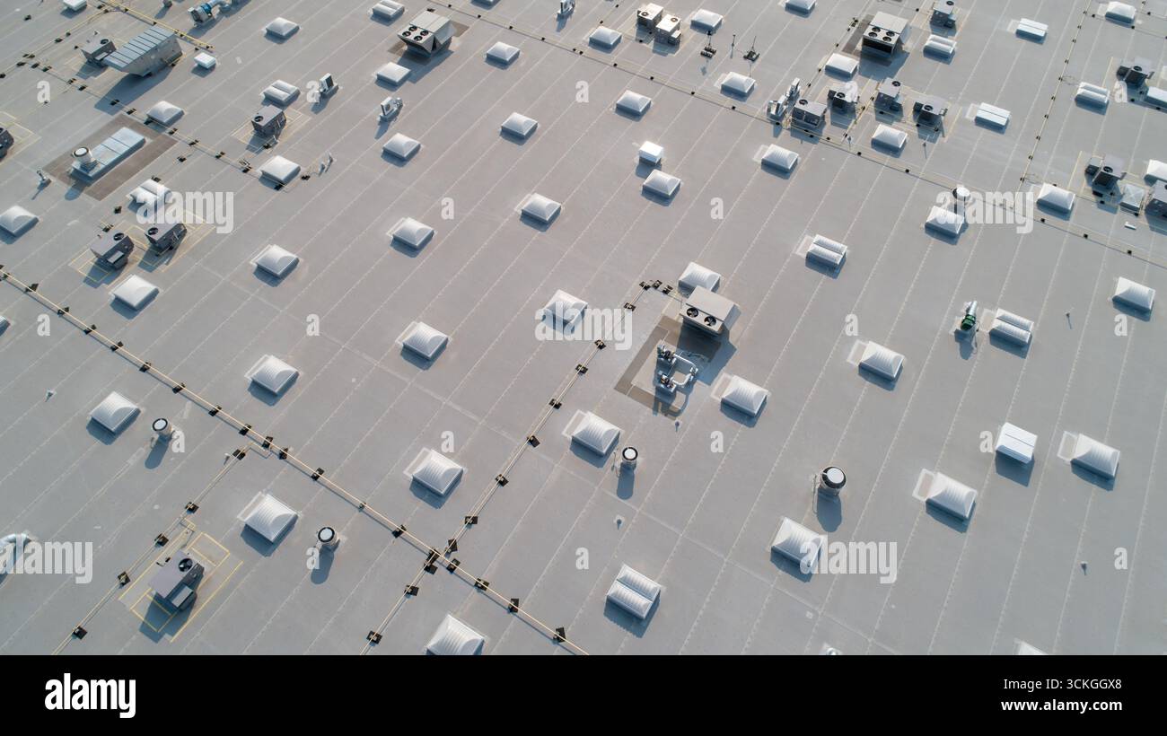 A large building with many windows and skylights Stock Photo