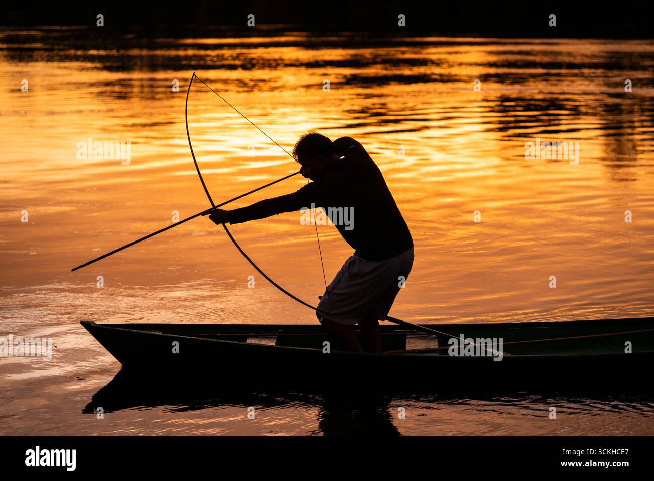 Beautiful sunrise view to local amazon indigenous man fishing Stock ...