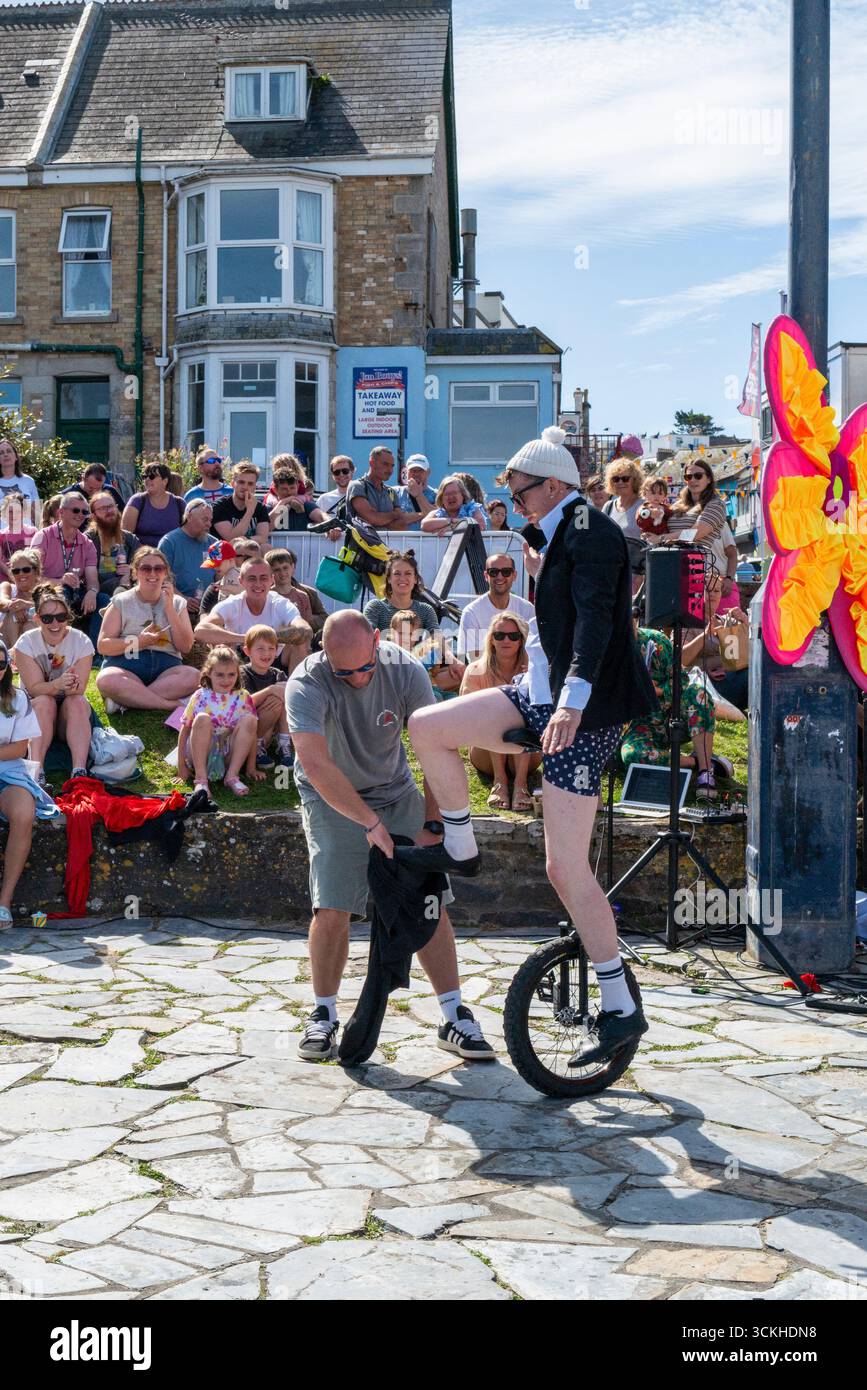 Sam Goodburn performing his show Wire Attire in Beachfield gardens in Newquay in Cornwall in England in the UK. Stock Photo