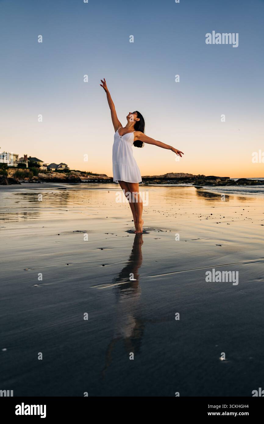 Woman dancing gracefully sunset beach hi-res stock photography and ...