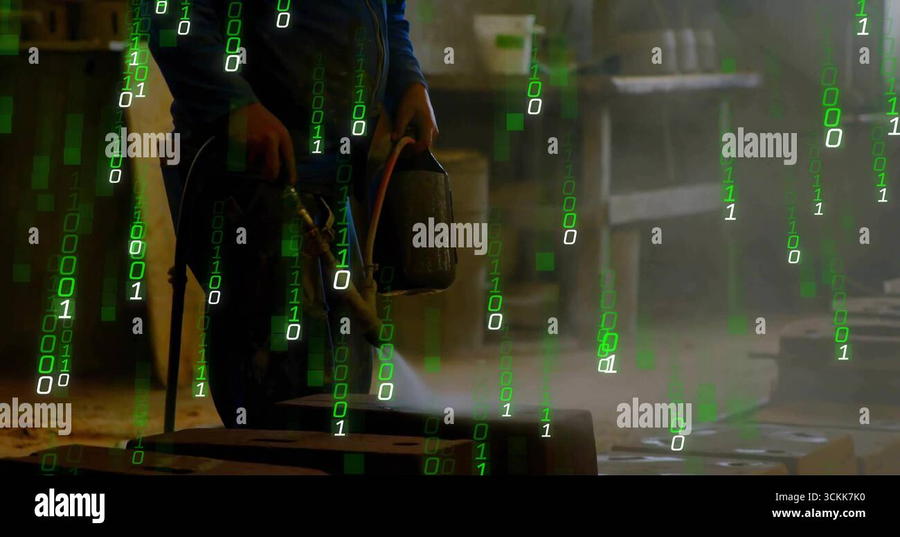 Metalworker wearing protective gear heating block using two torches in workshop, green code overlay Stock Photo
