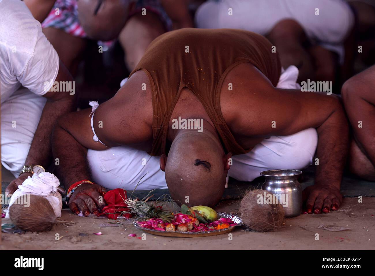 Small Head Ritual Prayagraj, India. 12 Sep.2025. People with shaved heads perform rituals ...