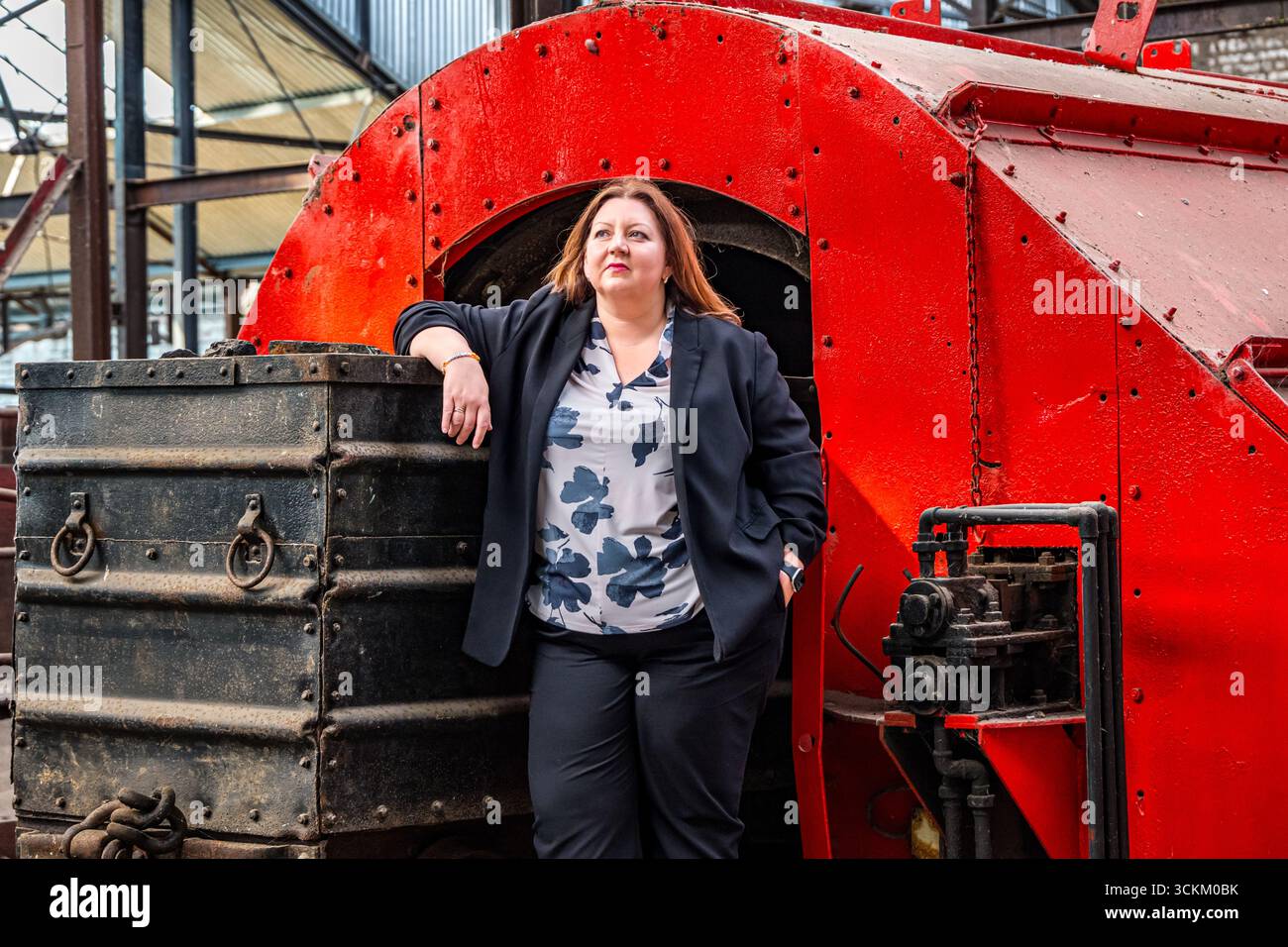 Portrait of Kirsty McNeill (Scottish MP) with coal truck or wagon, National Mining Museum, Newtongrange, Midlothian, Scotland, UK Stock Photo