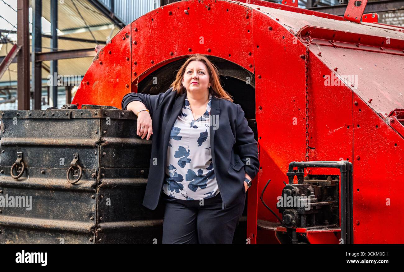 Portrait of Kirsty McNeill (Scottish MP) with coal truck or wagon, National Mining Museum, Newtongrange, Midlothian, Scotland, UK Stock Photo