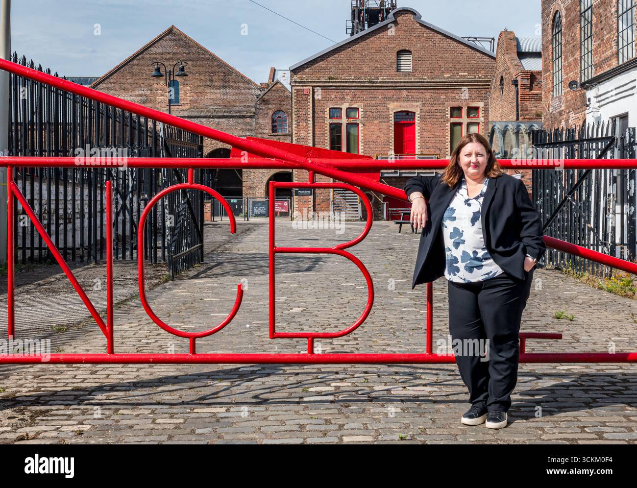 Portrait of Kirsty McNeill (Scottish MP) at NCB entrance gate, National Mining Museum, Newtongrange, Midlothian, Scotland, UK Stock Photo