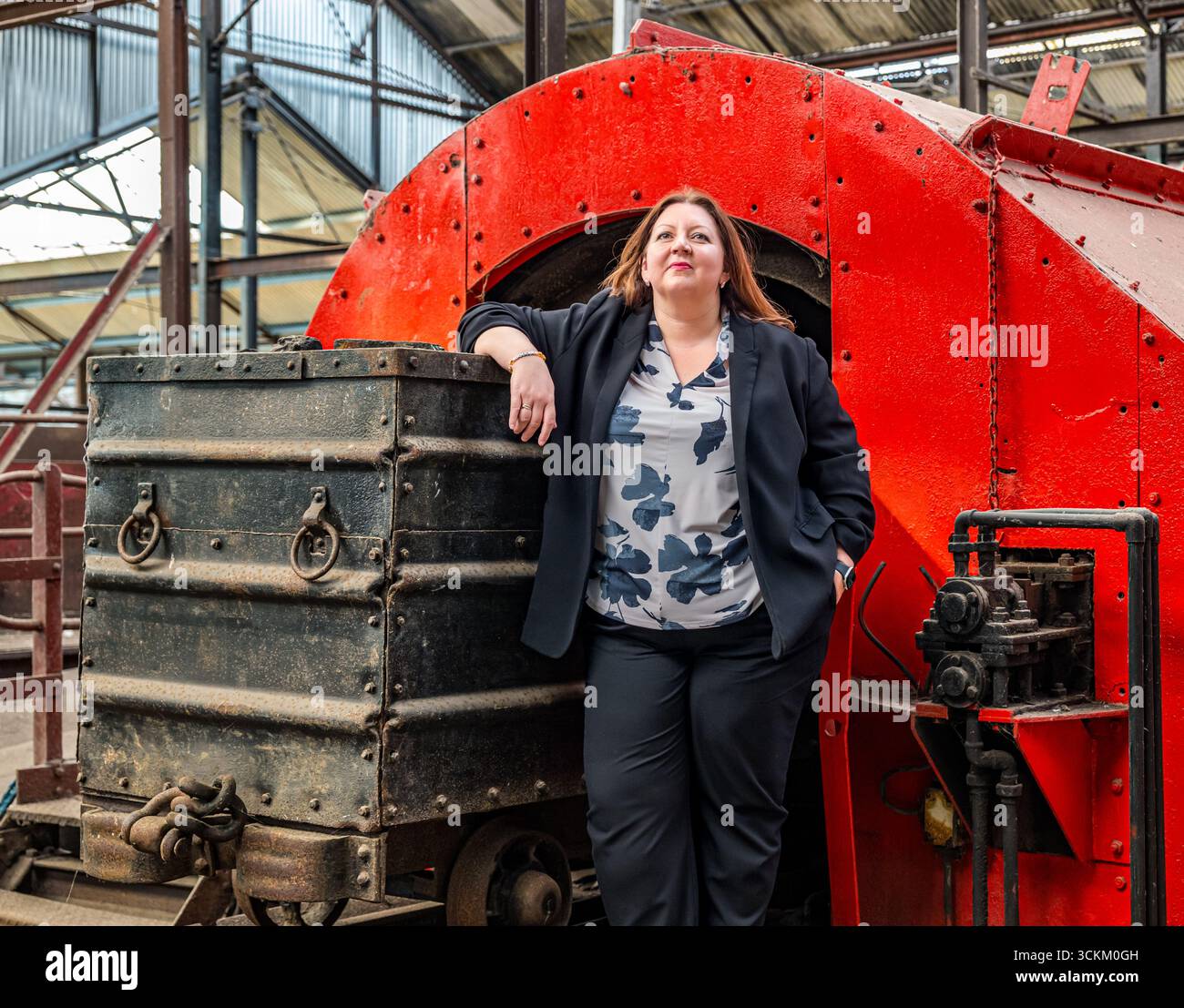 Portrait of Kirsty McNeill (Scottish MP) with coal truck or wagon, National Mining Museum, Newtongrange, Midlothian, Scotland, UK Stock Photo
