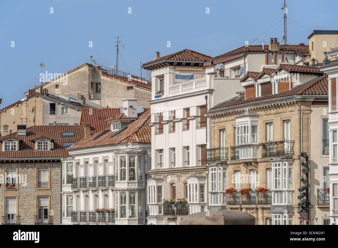 Historic Building Facades With Traditional Architecture In Vitoria Gasteiz Old Town Spain. Colorful Houses, Clay Tile Roofs, Iron Balconies, Basque Stock Photo