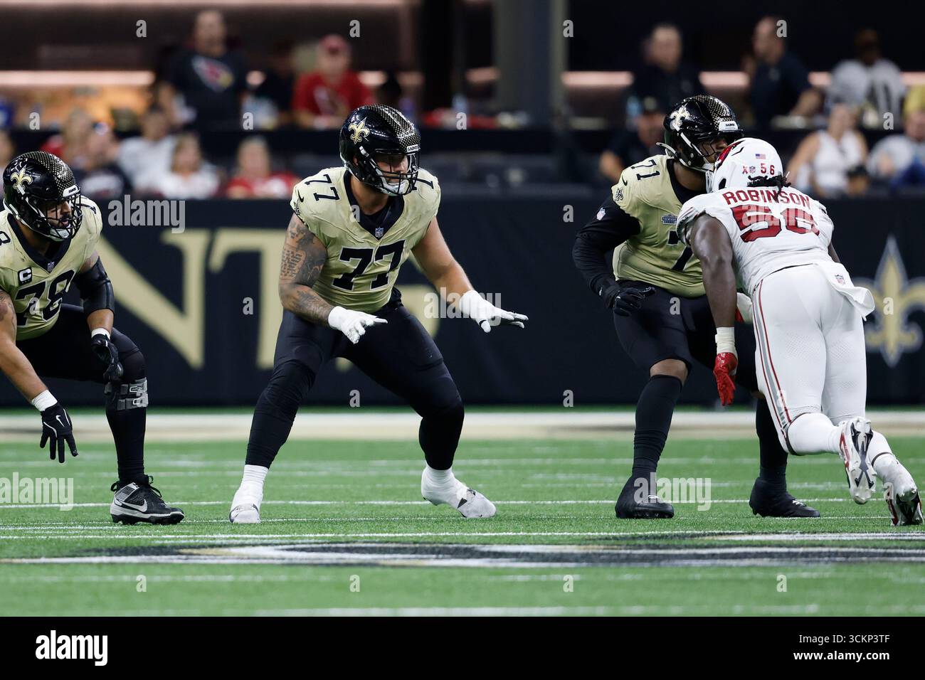 Dillon Cardinal New Orleans Saints offensive tackle Dillon Radunz (77) defends during ...