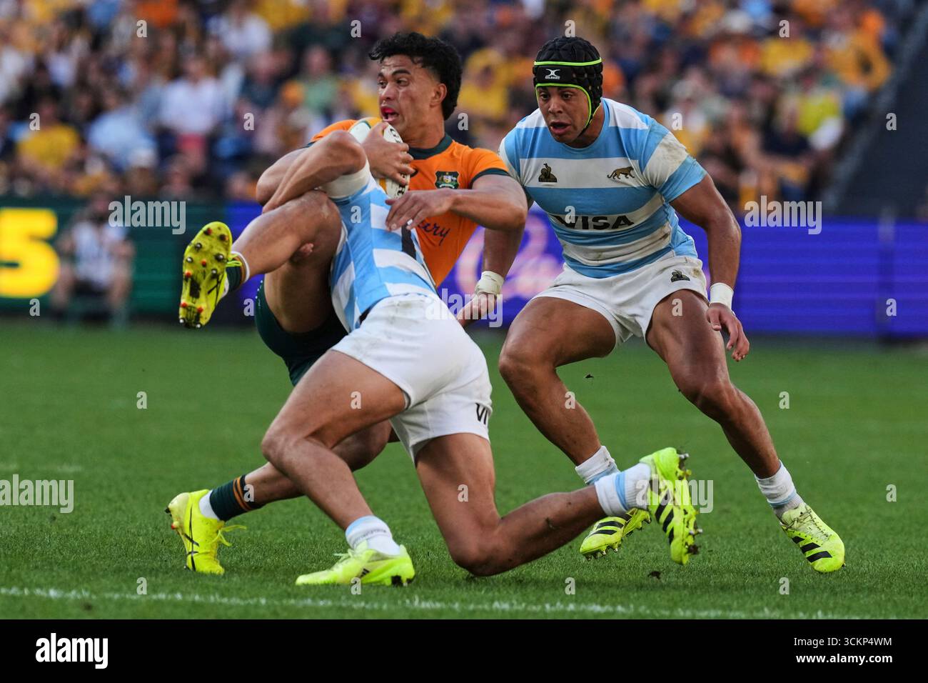 Sualli Australia's Joseph-Aukuso Suaalii is tackled by defenders during the ...
