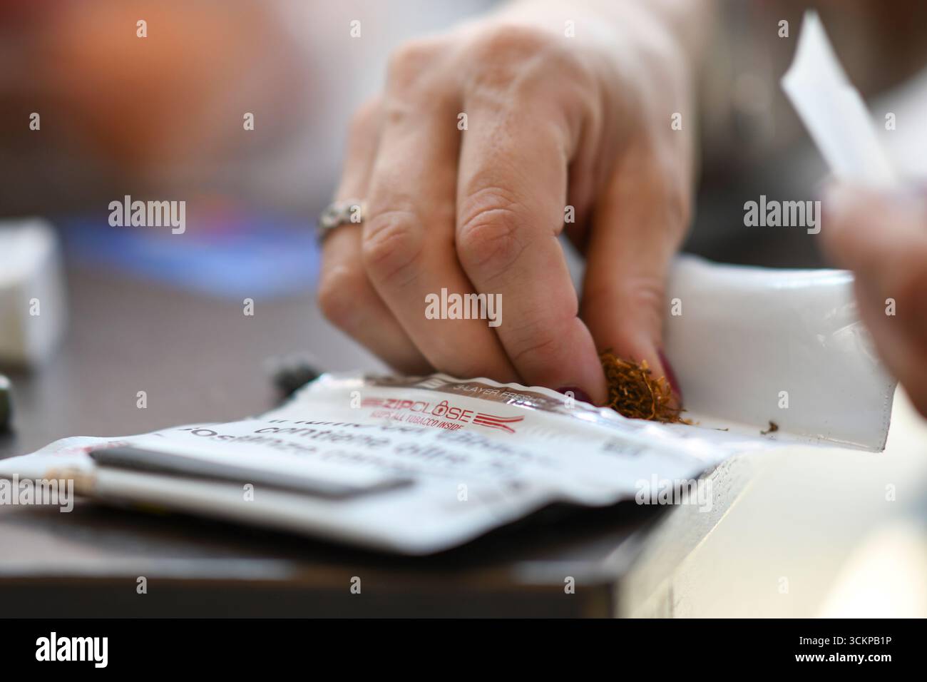rolling tobacco italy price Pueblo hand rolling tobacco hi-res stock photography and images