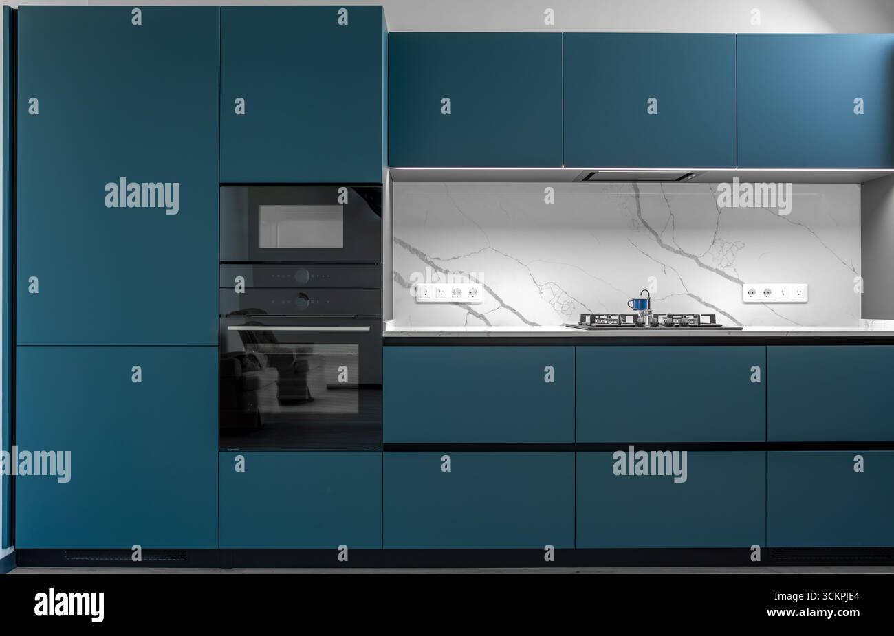 Modern kitchen unit. Built-in appliances. Matte blue cabinets Stock ...