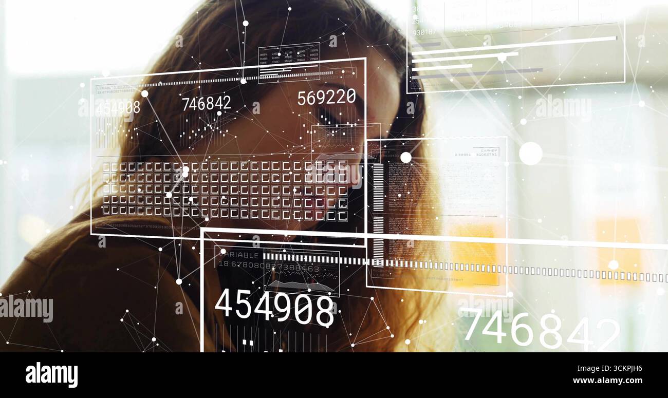 Analyzing adult woman reviewing data panels at office windows, showing ...