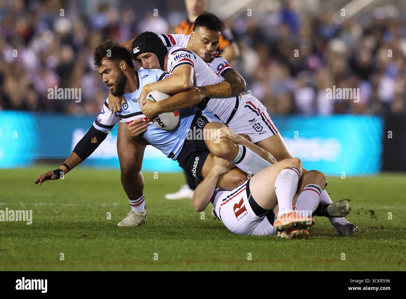 Toby Rudolf of the Sharks is tackled during the NRL Elimination Final ...