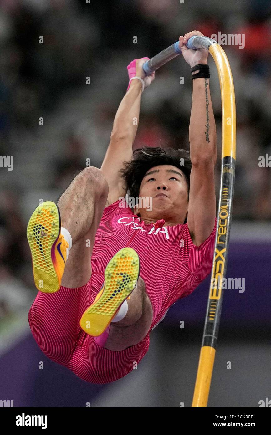 China's Li Chenyang competes in men's pole vault qualification at the ...
