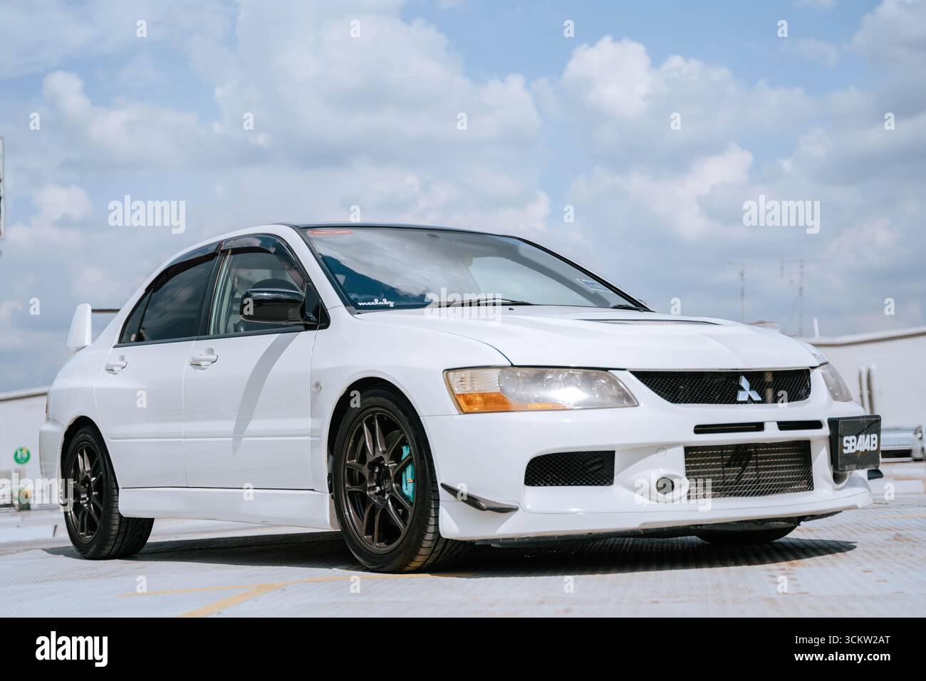 White Mitsubishi Evo 9 on an urban street Stock Photo