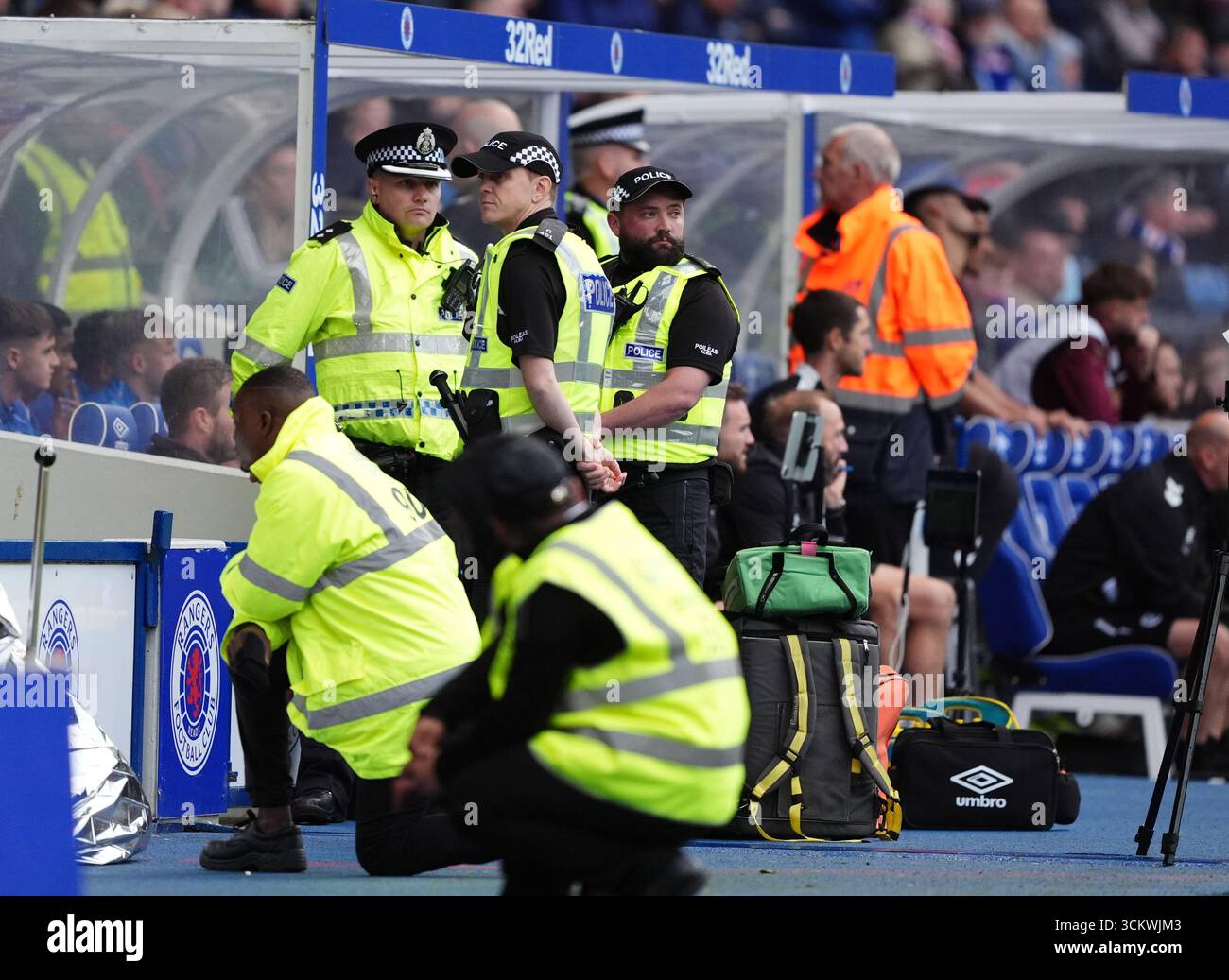Police officers near to the Rangers bench during the William Hill ...