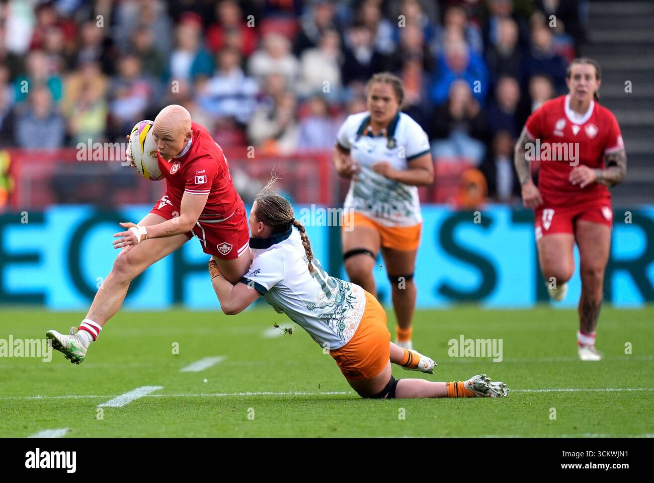 Canada's Olivia Apps is tackled by Australia's Caitlyn Halse during the ...