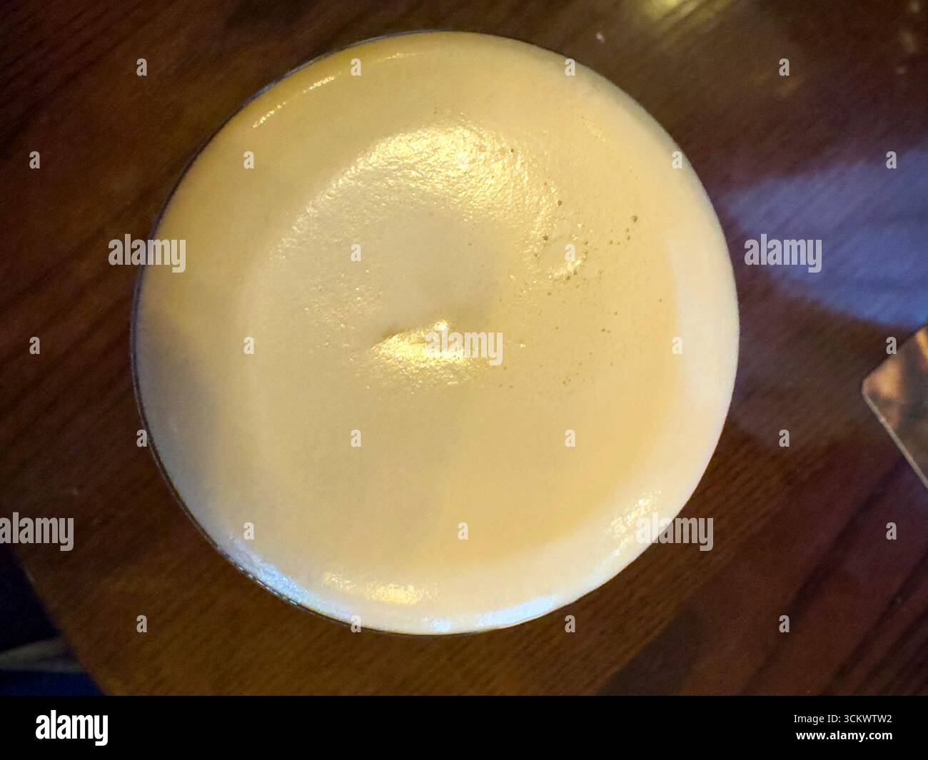 Beer head from above of a Pint of Guinness beer in The Oak pub, Parliament St, Temple Bar,  Dublin, Ireland - Smartphone Captured Stock Image