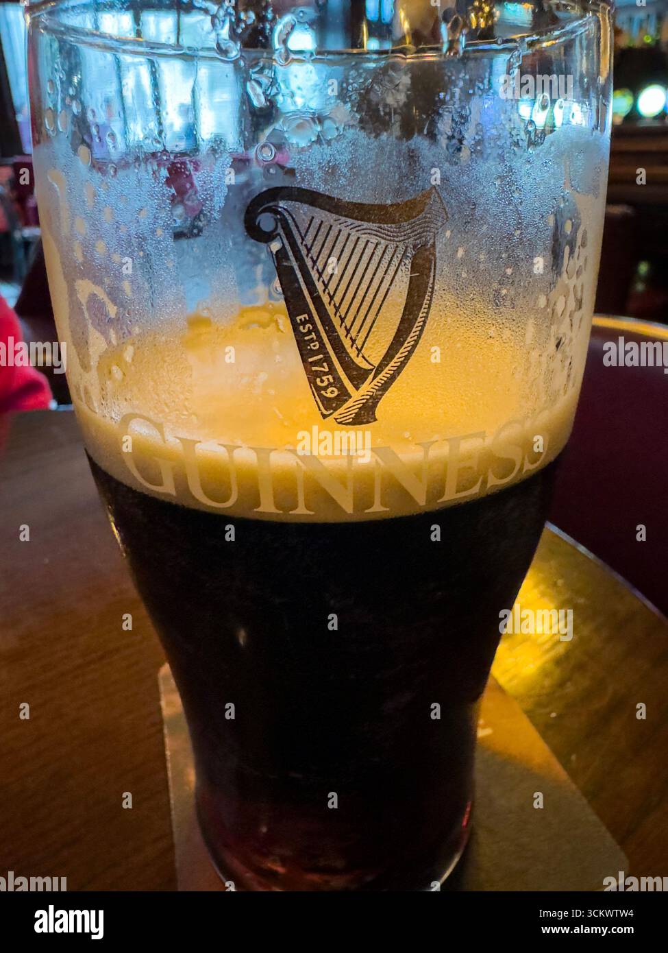 Half Pint of Guinness beer in The Oak pub, Parliament St, Temple Bar,  Dublin, Ireland - Smartphone Captured Stock Image