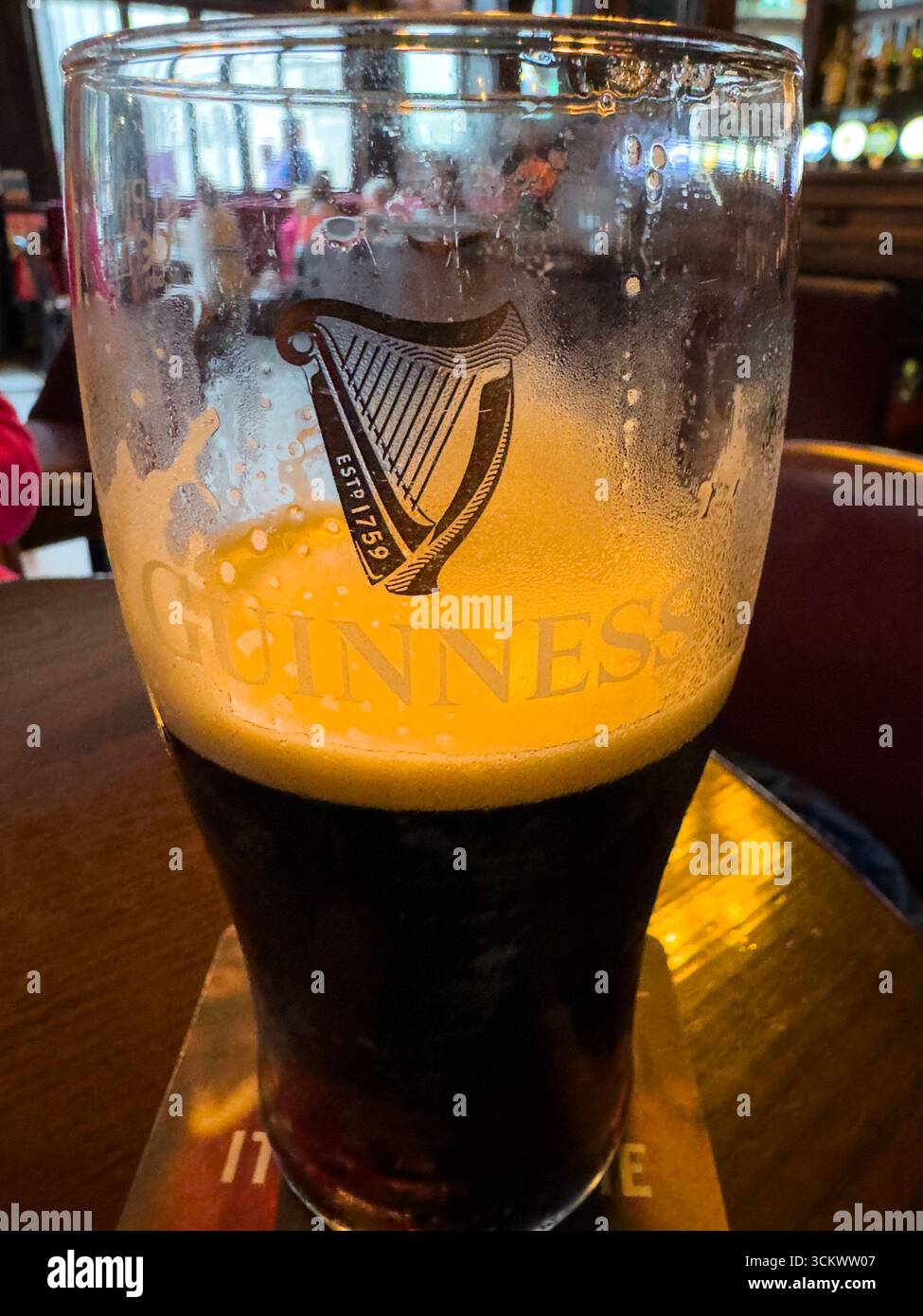 Half Pint of Guinness beer in The Oak pub, Parliament St, Temple Bar,  Dublin, Ireland - Smartphone Captured Stock Image