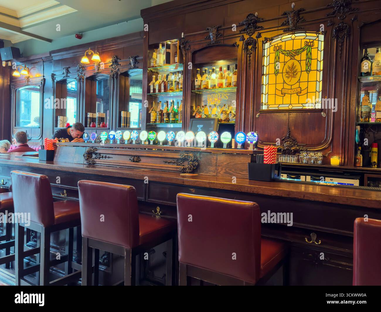 Beer and cider taps in the counter, The Oak, Parliament St, Temple Bar,  Dublin, Ireland - Smartphone Captured Stock Image