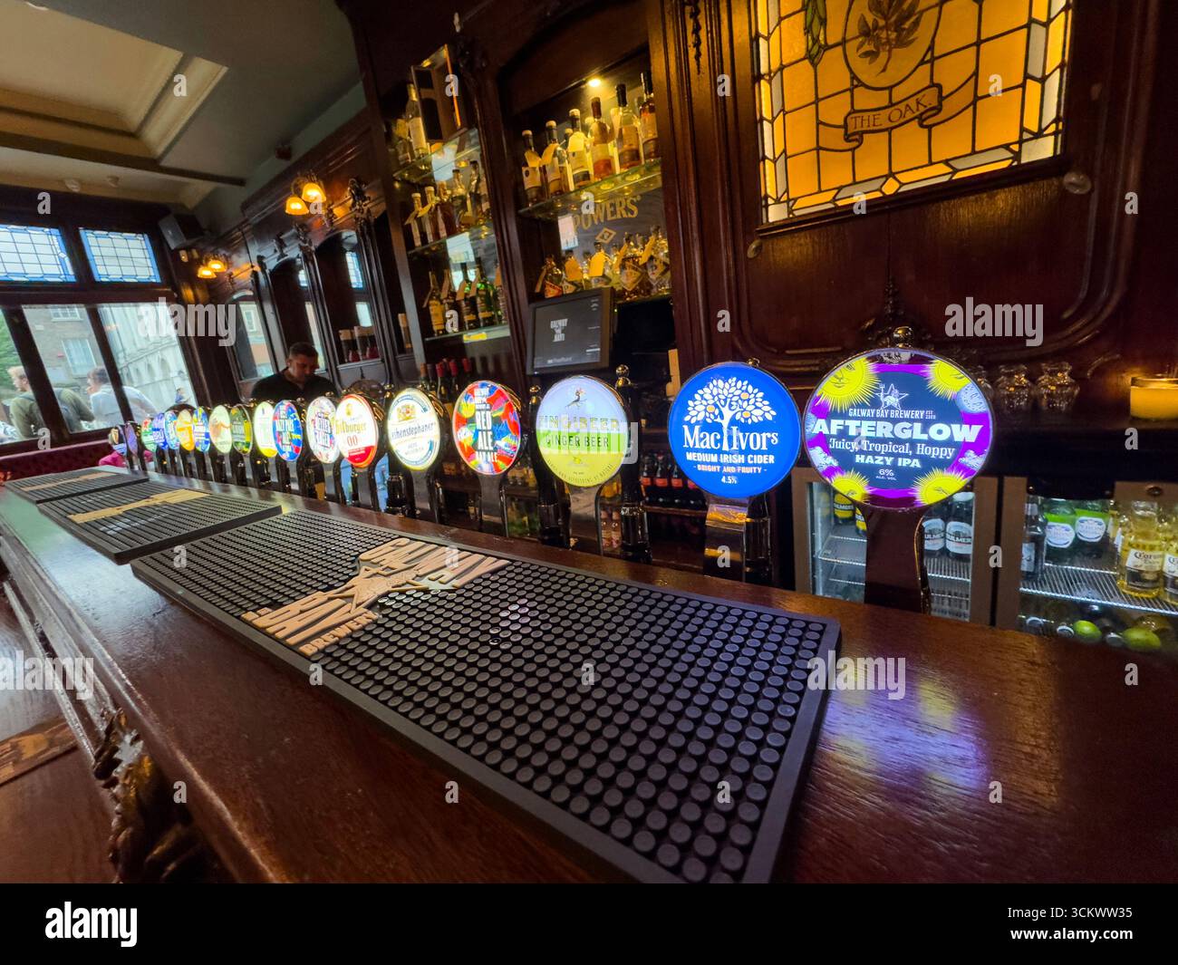 Beer and cider taps in the counter, The Oak, Parliament St, Temple Bar,  Dublin, Ireland - Smartphone Captured Stock Image