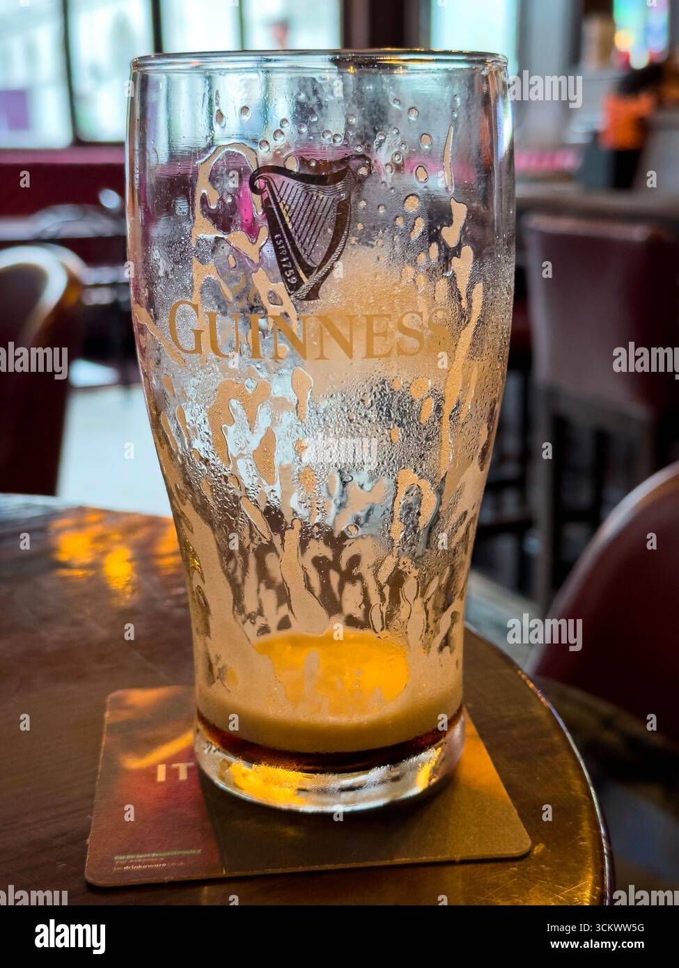Empty Pint of Guinness beer in The Oak pub, Parliament St, Temple Bar,  Dublin, Ireland - Smartphone Captured Stock Image