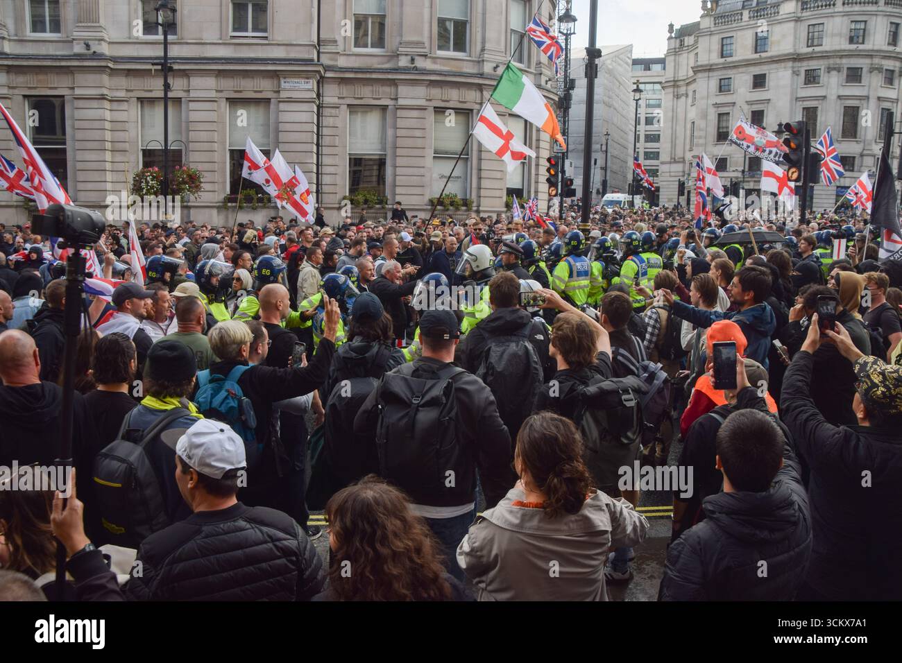 London, UK. 13th September 2025. Riot police keep far-right protesters ...