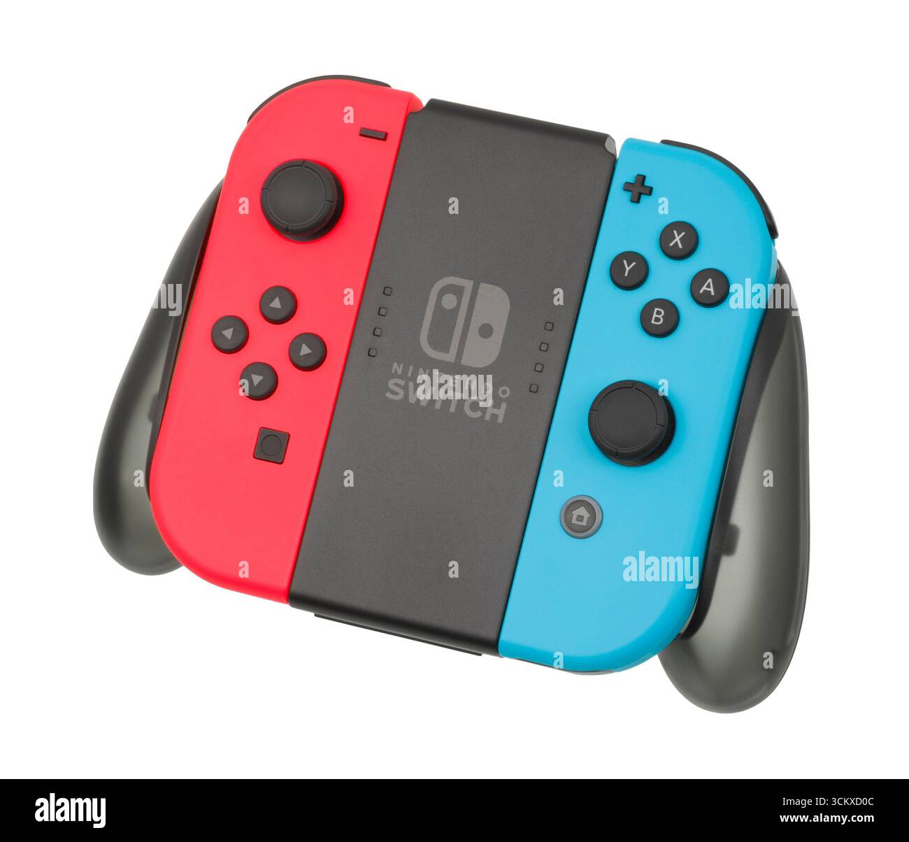 2017 Nintendo Switch Red and blue Joy-Con slotted onto the charging grip, Stock Photo