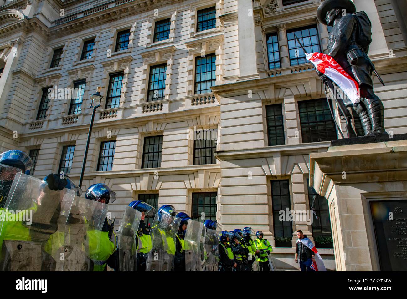 Riot police and the Gurkha Memorial, Horse Guards Avenue draped in a St ...