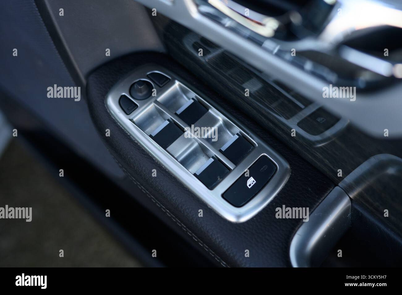 electric window control switches inside a modern car, focusing on the ...