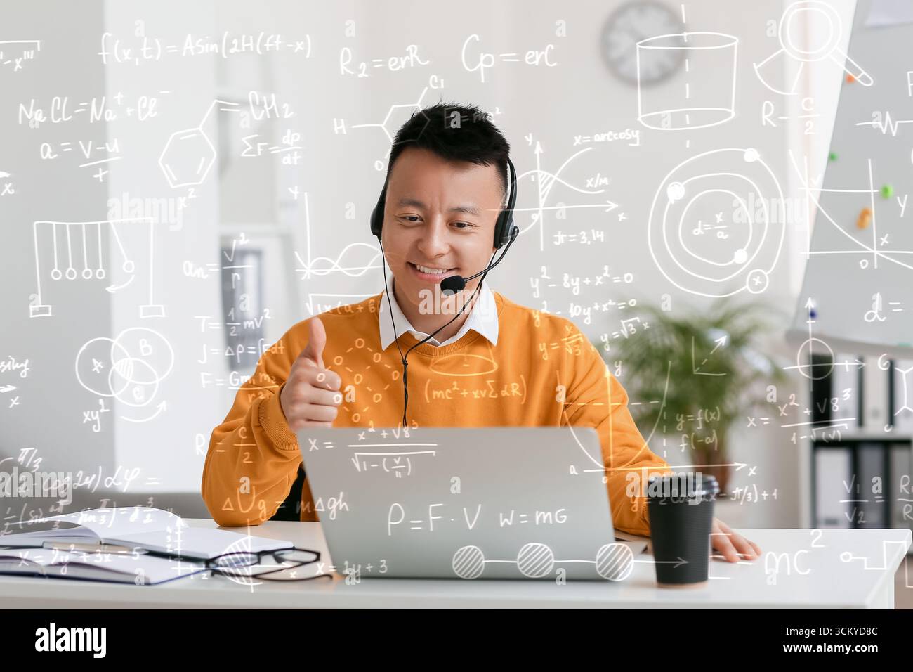 Asian teacher conducting lesson online Stock Photo